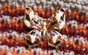 A slip-stitch cowl made to match this vintage butterfly pin. Total Fall colors!